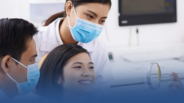 Doctors giving patient an exam